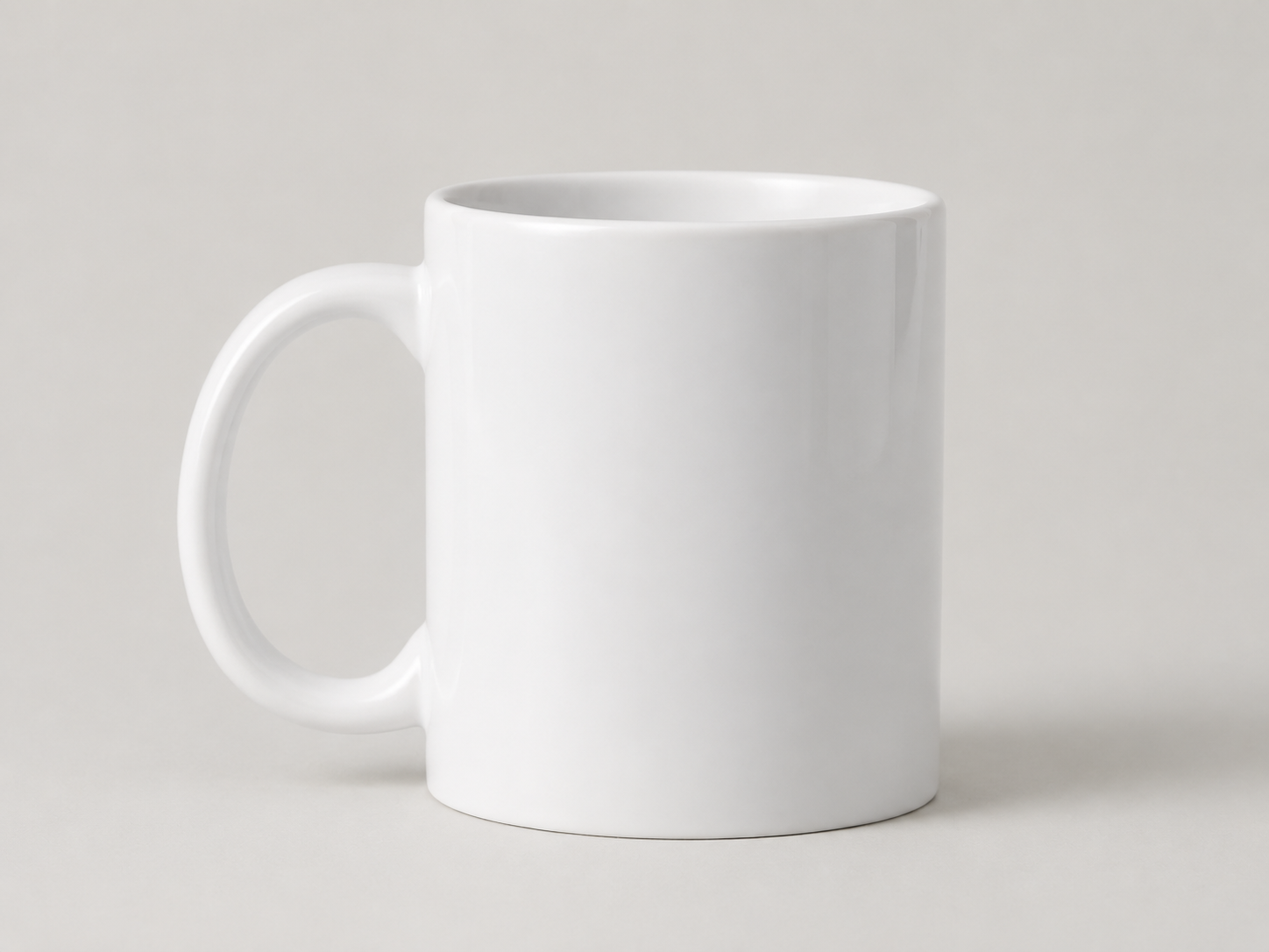 The cat sticker placed on a coffee mug